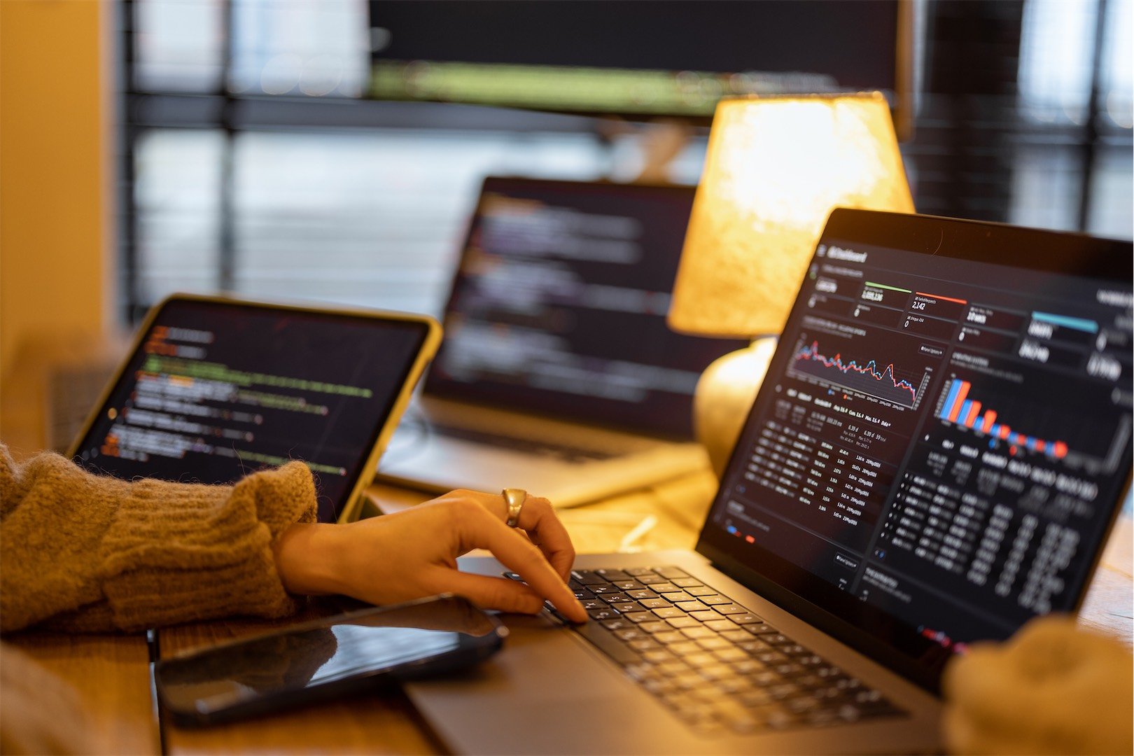 Person using a laptop looking at the UI of a dashboard